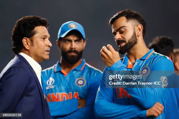 Sachin Tendulkar and Virat Kohli sharing a moment on the field